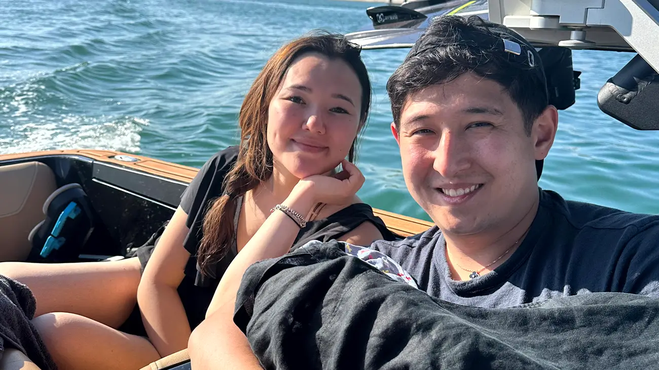 married couple in a date on a boat